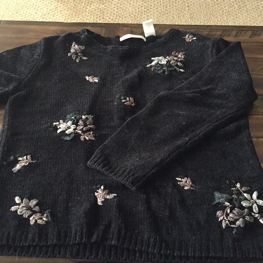 Black sweater with flower detail